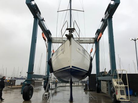 Bavaria Yacht at Marina lift out for anti fouling and polish.